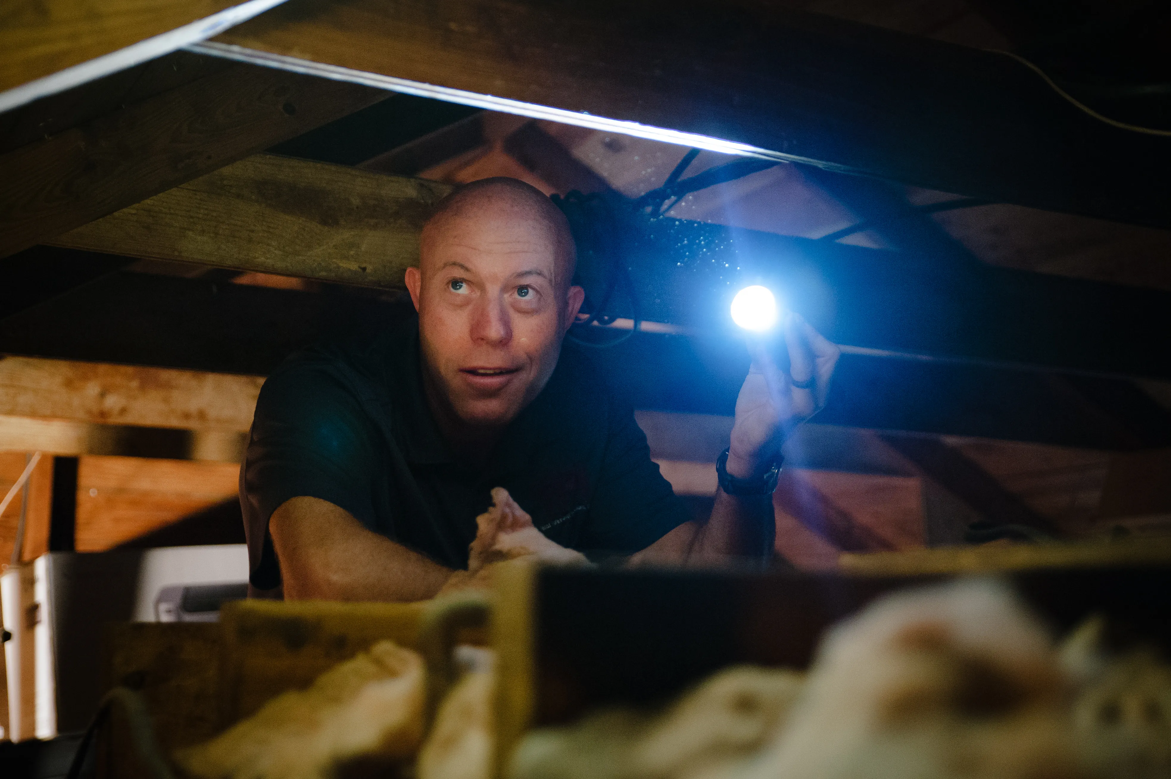 Home inspector in attic